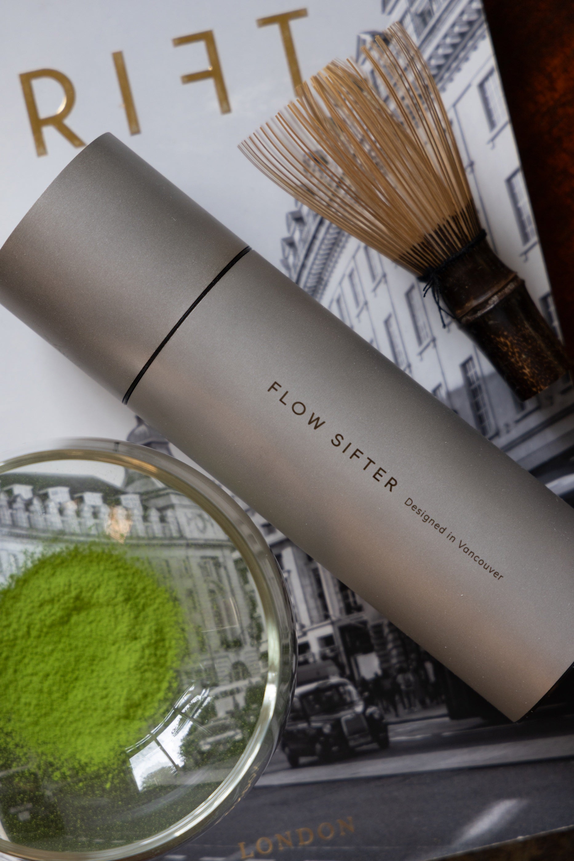 Matte Flow Sifter with a bamboo whisk and a glass bowl of matcha